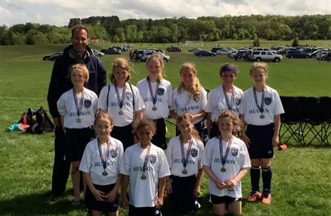 Dr. Youssef with daughters soccer team