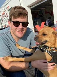 Dr. Tyler Smiling with his dog